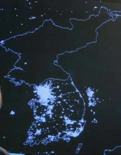 south korea north korea at night. North Korea is